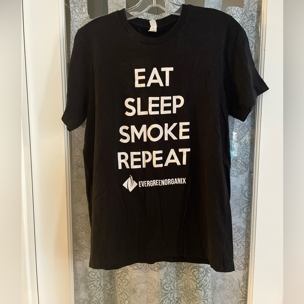Cannvas Black Unisex T-Shirt. “Eat Sleep Smoke Repeat” Printed On Front Medium